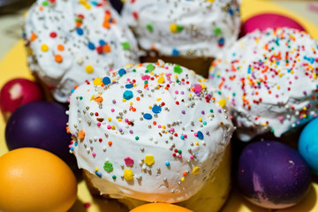 Easter cake and painted eggs on the table