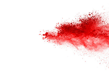 Freeze motion of red powder exploding, isolated on white background. Abstract design of red dust cloud. Particles explosion screen saver, wallpaper