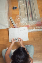 Instruction for furniture assembling in the female hands for self assembly.