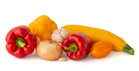 Onion garlic pink tomato red and yellow bell peppers and squash on white background