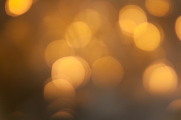 Blurred golden sparkling festive bokeh background