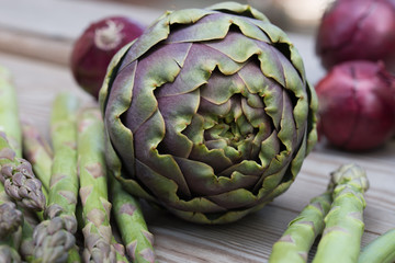 Obraz premium artichoke, asparagus, red onion healthy green and violet vegetables