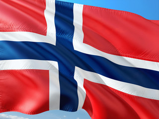 Flag of Norway waving in the wind against deep blue sky. High quality fabric.