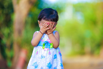 cute indian baby girl  playing in the park