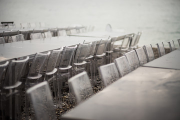 The transparent chairs for the party are rows on the beach