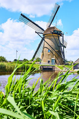 Netherlands rural lanscape with windmills at famous tourist site Kinderdijk in Holland. Old Dutch village Kinderdijk, UNESCO world heritage site. 