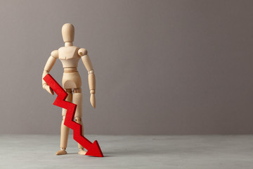 Businessman holds red down arrow chart. Drop in profitability or bankruptcy, decline in income. Copy space for text.