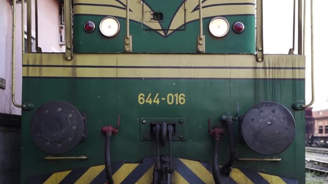 Steam train in the mornign on a train station with smoke