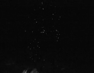 sparks of fire on a black background at night