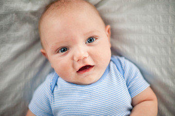 Happy Baby Boy Lying on Bed