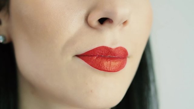 Female red lips close up. Girl red lips