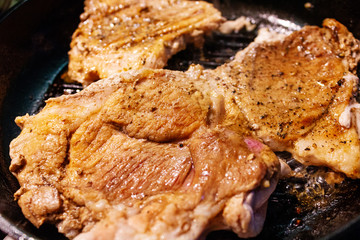 Close Pan View of Cooking Red Meat