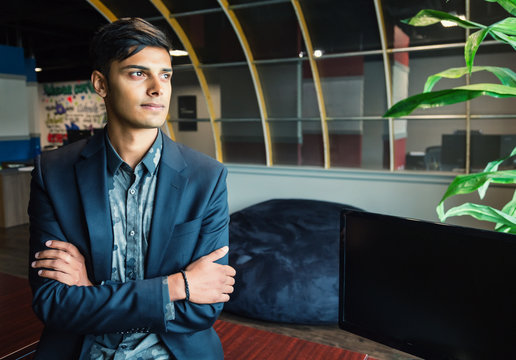 Portrait of a young millennial businessman in the workplace; Sherwood Park, Alberta, Canada