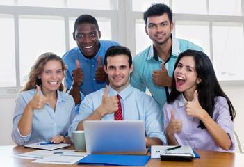 Group of international business people showing thumbs up