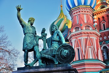 Fototapeta na wymiar Monument to Minin and Pozharsky and Saint Basils Cathedral on the Red Square in Moscow 