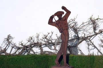 Ronda, Spain, February 2019. Rusty metal monument to the bullfighter near the famous bullring in...