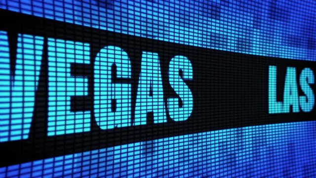 LAS VEGAS side Text Scrolling on Light Blue Digital LED Display Board Pixel Light Screen Looped Animation 4K Background. Sign Board , Blinking Light, Pixel Monitor . LED Wall Pannel