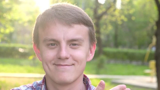 Guy showing different emotions on his face with his hands