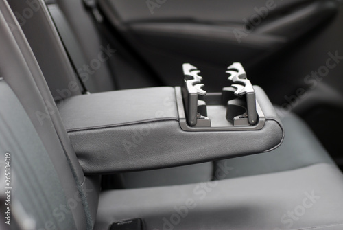 armrest in the car with can holders, rear seats