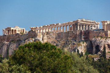 Fototapeta na wymiar Acropolis hill, Greece. Famous old Acropolis is a top landmark of Athens. Ancient Greek ruins in the Athens center