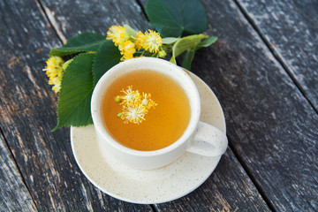 linden flowers herbal Cup of healthy tea with honey. alternative or complementary medicine, traditional medicine. soft focus image