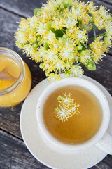 linden flowers herbal Cup of healthy tea with honey. alternative or complementary medicine, traditional medicine. soft focus image