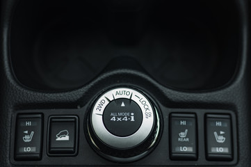 button switches control for car with soft-focus and over light in the background. 2WD AUTO LOCK BUTTON SWITCH
