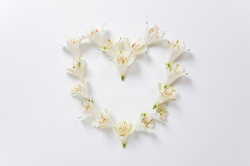 The heart shape made from flowers of Alstroemeria and text space