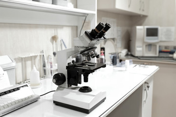microscope on table in laboratory. Research and analysis