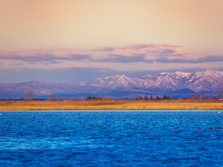 Sea, flat region and mountains in the background - Greece