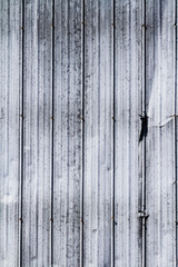 Steel wall texture with dent on the side; weathered steel wall with grunge like markings