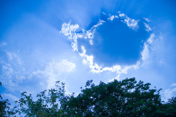 Blue sky with clouds, fluffy white cloud on air clear blue sky weather background texture.