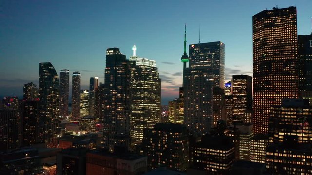 29.98P dusk flying left view of Toronto skyline