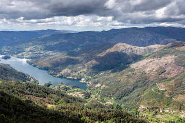 Naklejka na ściany i meble Scenic view of Cavado river and Peneda Geres National Park in northern Portugal.