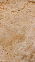 Background of the old wall. Texture of stone surface. Abstract background in retro style. Brown surface of solid material