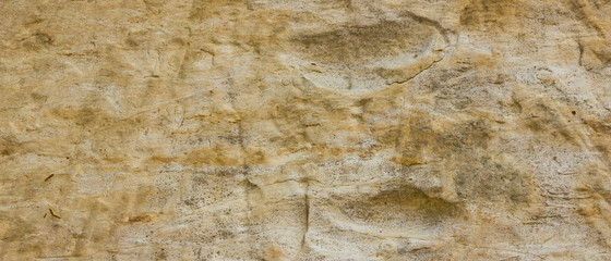 Background of the old wall. Texture of stone surface. Abstract background in retro style. Brown surface of solid material