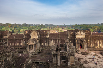 Fototapeta na wymiar Tourists inside the upper tower area of Angkor Wat temple, Siem Reap, Cambodia