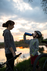 Family bike ride at sunrise