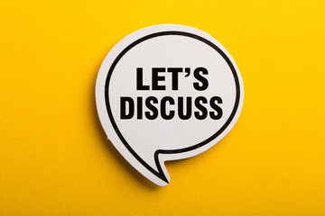 Let Us Discuss Speech Bubble Isolated On Yellow Background