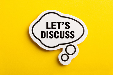 Let Us Discuss Speech Bubble Isolated On Yellow Background
