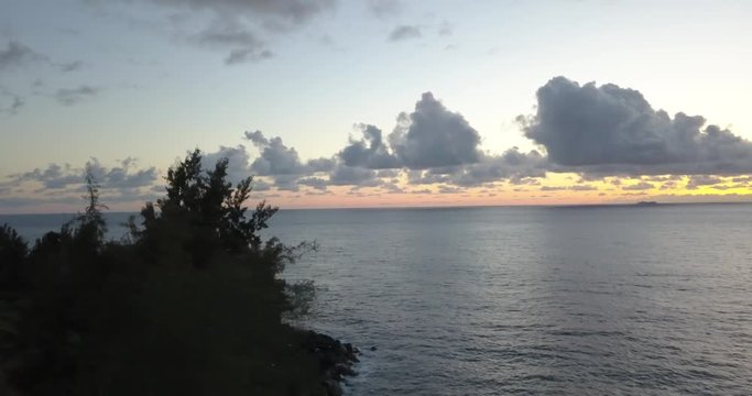 Aerial/Drone - Diagonal Drop During Sunrise with Cruise Ship (Hamakua Coast - Big Island, Hawaii)