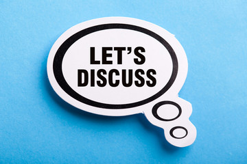 Let Us Discuss Speech Bubble Isolated On Blue Background