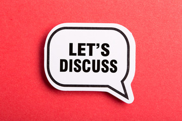 Let Us Discuss Speech Bubble Isolated On Red Background