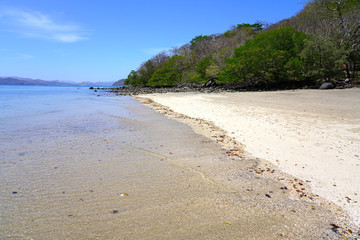 View of the black sand volcanic Playa Sombrero Obscuro beach in Peninsula Papagayo in Guanacaste, Costa Rica