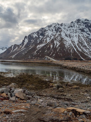 Reflection of mountain on fjord  during winter, Norway