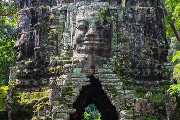 Face details from the beautiful north gate at Angkor Thom temple complex, Siem Reap, Cambodia