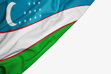 Uzbekistan flag of fabric with copyspace for your text on white background.
