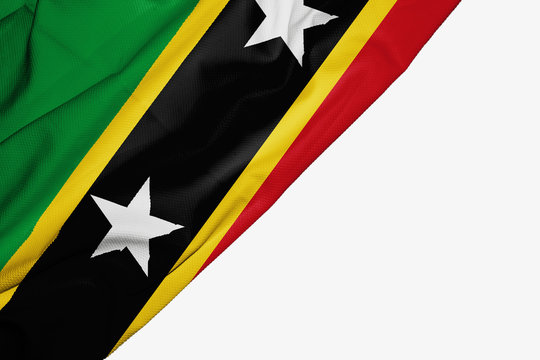 Saint Kitts and Nevis flag of fabric with copyspace for your text on white background.