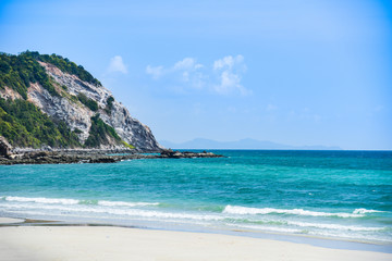 Beach sand tropical sea summer / Island beautiful beach clear water and moody blue sky with hill rock