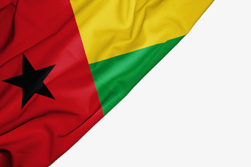Guinea Bissau flag of fabric with copyspace for your text on white background.